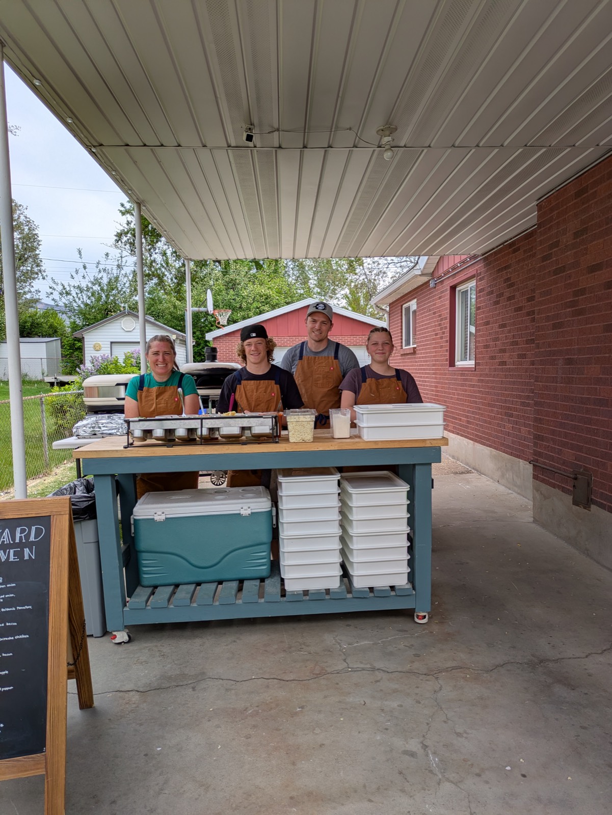 The Backyard Brick Oven team ready to serve at an event
